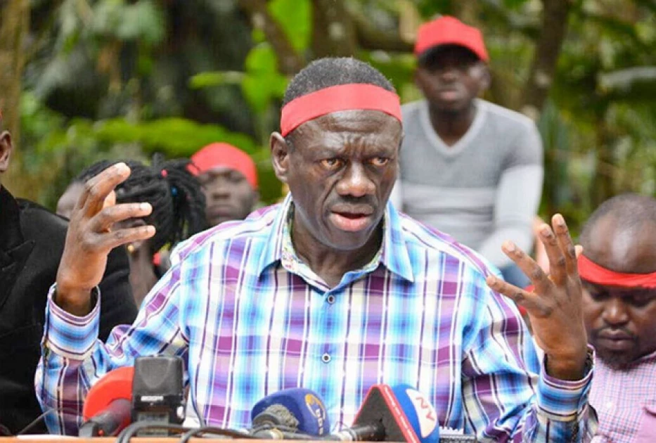 An image of Kizza Besigye, prominent Ugandan opposition leader, addressing a crowd during a political rally.